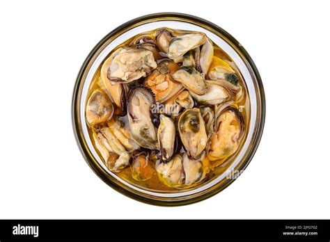 Marinated Mussels Isolated In A Jar On A White Background Full Depth