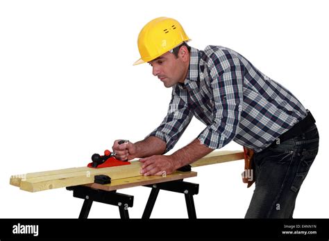 Builder planning wood Stock Photo - Alamy