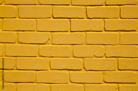 Texture of yellow brick wall as background. Stock Photo | Adobe Stock