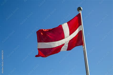 Photograph of the Danish Flag called "Dannebrog". Stock Photo | Adobe Stock