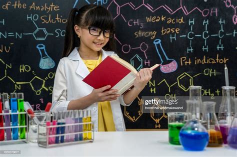 Girl Cute School Pupil Play With Test Tubes And Colorful Liquids School