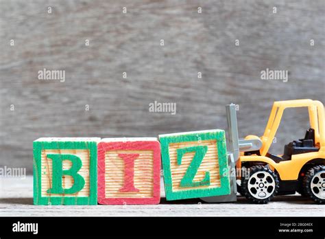 Toy Forklift Hold Letter Block Z To Complete Word Biz Abbreviation Of