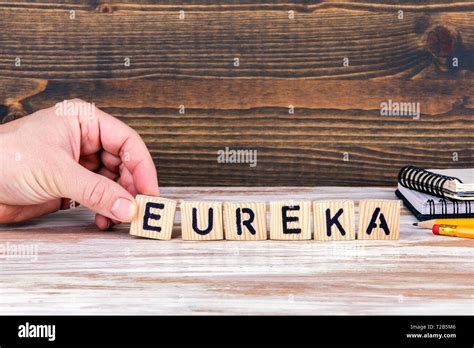 Eureka Wooden Letters On The Office Desk Informative And