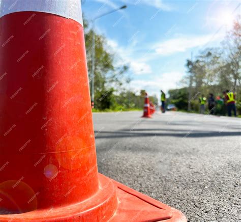 Premium Photo | Orange warning traffic cones set up in the middle of ...