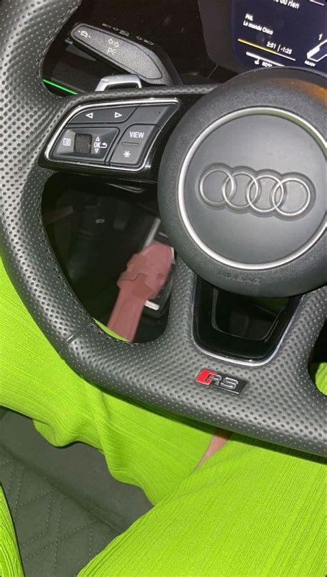 The Interior Of An Audi Car With Green Leather Seats And Steering Wheel