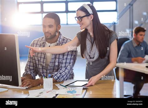 Business people working on computer in office Stock Photo - Alamy