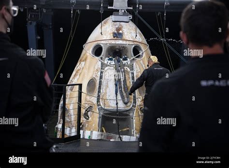 Support Teams Prepare To Open The Hatch On The Spacex Crew Dragon