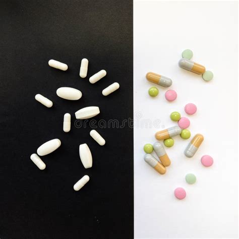 Colorful Tablets With Capsules And Pills On Black Background Stock