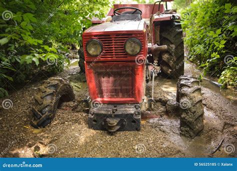 Tractor stuck in the mud stock image. Image of drowned - 56525185