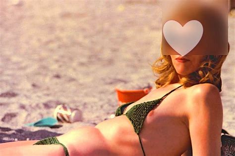 MILF Popping A Nip On The Beach Porn Pic