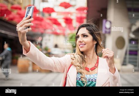 Attractive Young Model Fashion Woman Taking Selfies With Mobile Phones