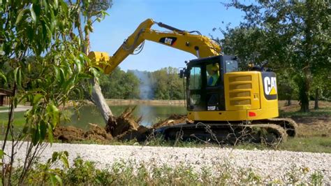 The Cat® 315f Hydraulic Excavator Clearing Land Youtube