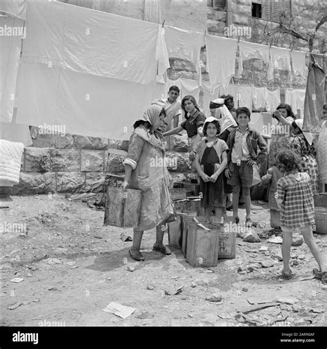 Israel 1948-1949: Jerusalem Women and children at a water source, under ...