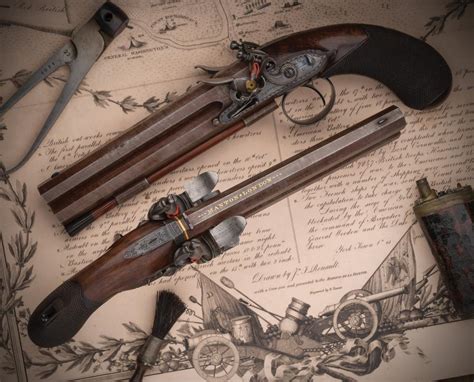 At Auction Cased Pair Of John Manton Overunder Flintlock Pistols