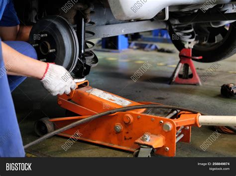 Mechanic Replace Shock Image & Photo (Free Trial) | Bigstock