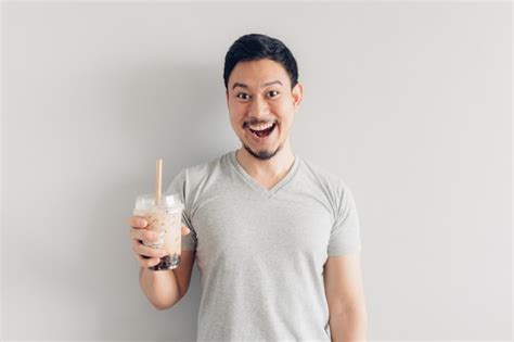 Premium Photo Happy Man Is Drinking Bubble Milk Tea Or Pearl Milk Tea Popular Milk Tea In