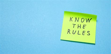 Premium Photo | Know The Rules on sticky note on the blue background