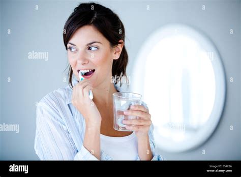 Woman Brushing Her Teeth Stock Photo Alamy