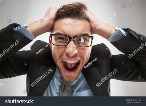 Closeup Portrait Of Angry Frustrated Man Pulling His Hair Out