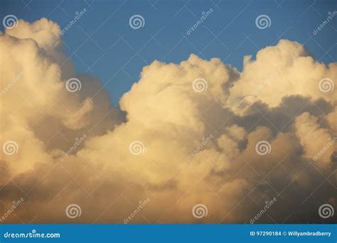 Fluffy big sunset clouds stock photo. Image of white - 97290184