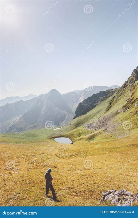 Man Hiking Alone in Mountains Travel Adventure Stock Photo - Image of ...