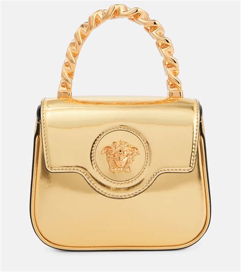 La Medusa Mini metallic leather tote bag in gold - Versace | Mytheresa