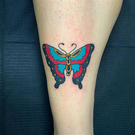 Hand Poked Butterfly Tattoo Located On The Shin