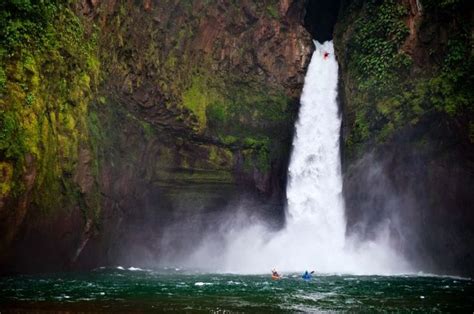 A Man Is Kayaking In Front Of A Waterfall With The Caption 120 Feet In