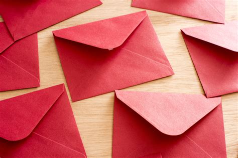 Photo of Scattered festive red Christmas envelopes | Free christmas images