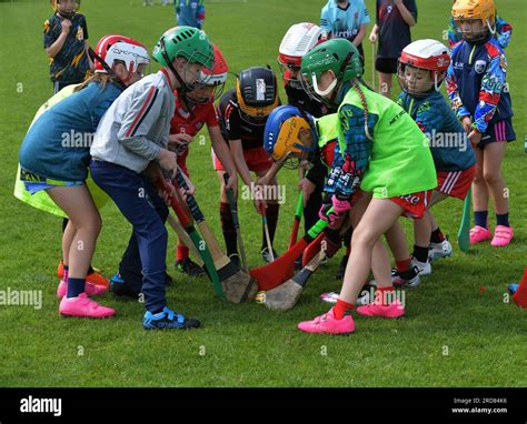 Primary School Children Playing Hurling In Derry Northern Ireland