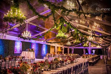 A Banquet Hall With Tables And Chairs Set Up For A Formal Function