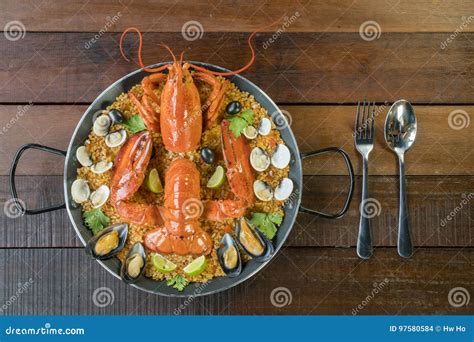 Paella With Fresh Lobster Clams Mussels And Lime Stock Photo Image