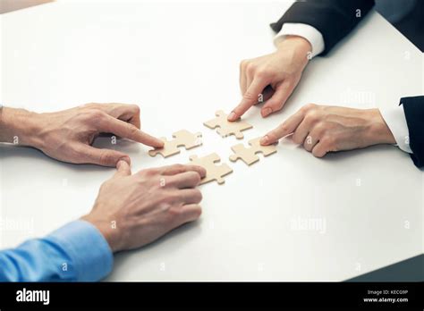 Business Team Building Puzzle Pieces Hi Res Stock Photography And