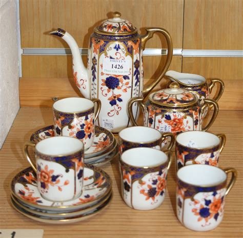 A Noritake Porcelain Coffee Set Decorated After The Imari Comprising