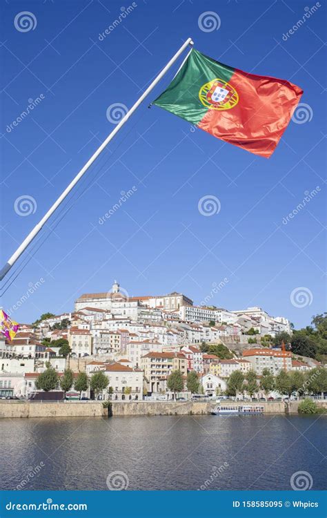 Old Town View Of Coimbra From Santa Clara Bridge With Portugal Flag