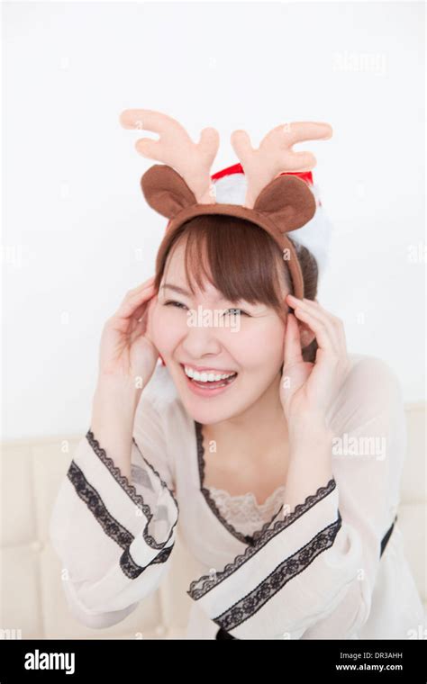 Young woman with reindeer antlers Stock Photo - Alamy