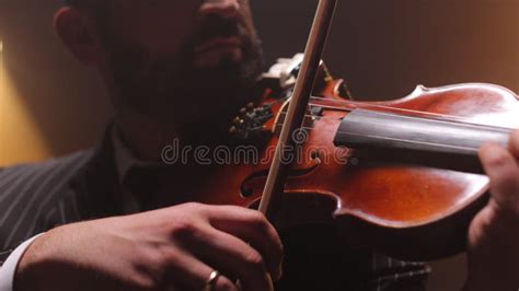 Man In Striped Suit Playing Melody On Violin On Stage Stock Footage