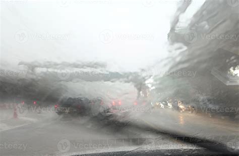 Road View Through Car Window With Heavy Rain And Storm Hits Driving In