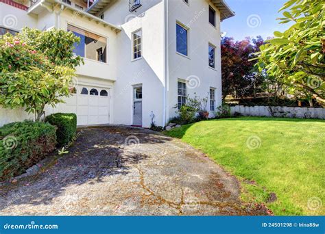 White Spanish Style Home With Garage And Backyard Stock Photo Image