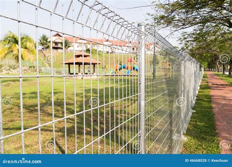 Security Boundary Fencing At A Residential Community Stock Photo