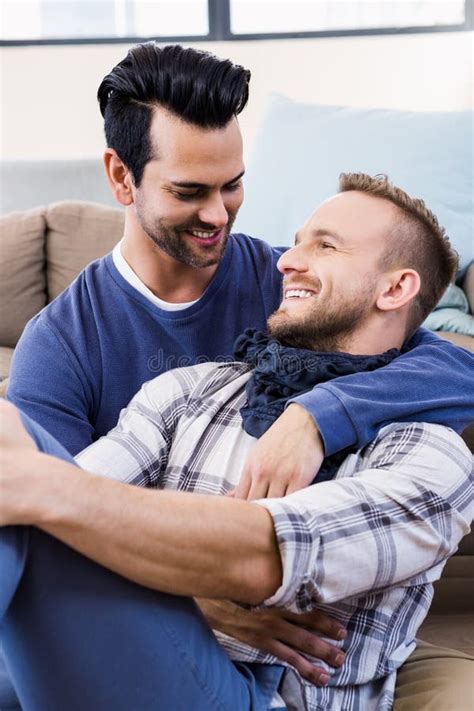 Gay Couple Hugging On The Couch Stock Image Image Of Enjoyment Couple 66087995
