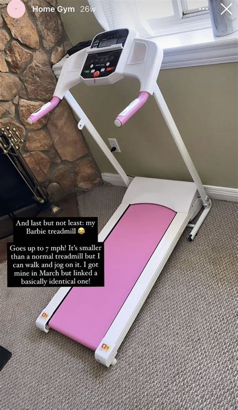 A Pink Treadmill Sitting In Front Of A Stone Wall With A Quote On It