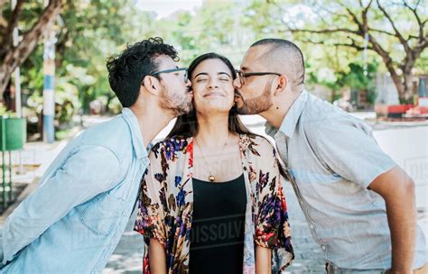 Love Triangle Concept Polygamy Concept Two Men Kissing A Girl Cheek Portrait Of Two Guys