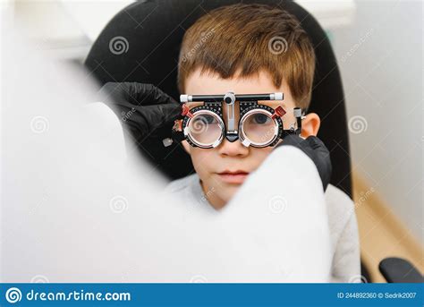 Cheerful Child Boy In Glasses Checks Eye Vision Pediatric