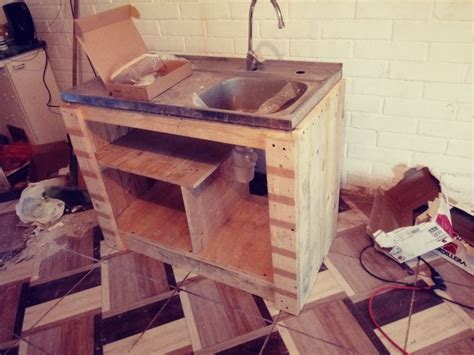 An Unfinished Sink In The Middle Of A Room That Is Being Remodeled With