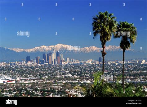 Snow covered San Gabriel Mountains behind downtown Los Angeles skyline ...