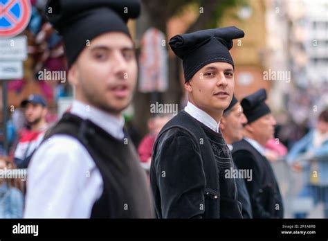 Sardinian Men Dressed In Folk Traditional Costumes With Unique