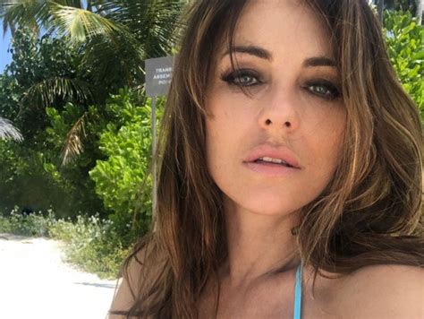 Watch Elizabeth Hurley Show Off Cleavage While Posing In A Tiny Bikini Top Blacksportsonline