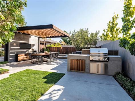 Contemporary backyard featuring built in bbq grill outdoor kitchen and ...