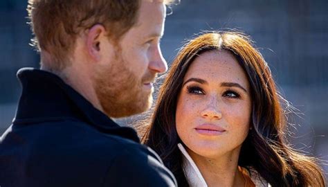 A Man And Woman Looking At Each Other